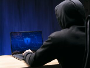 close up programmer typing laptop