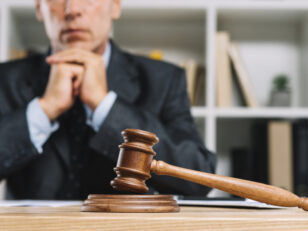 wooden judge gavel table front lawyer scaled