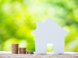 world habitat day close up picture pile coins model house scaled