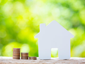 world habitat day close up picture pile coins model house scaled